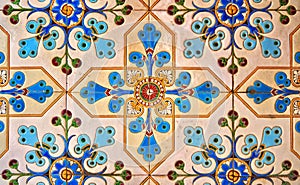 Ceramic tiles with colorful floral and geometric patterns for wall and floor decoration. Old concrete block surface background