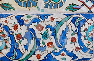 Ceramic tiles with flowers on designed wall of famous historical Topkapi palace, Istanbul.