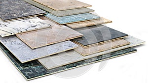 Ceramic tiles samples in different sizes and colour spectrum stacked one on another.