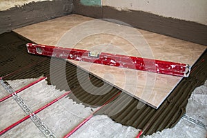 Ceramic tiles and tools for tiler. Floor tiles installation. Home improvement, renovation - ceramic tile floor