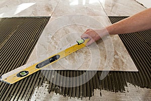 Ceramic tiles and tools for tiler. Floor tiles installation. Home improvement, renovation - ceramic tile floor