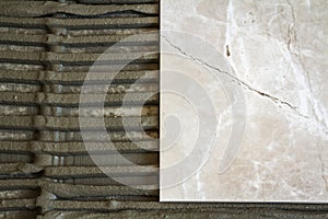 Ceramic tiles and tools for tiler. Floor tiles installation. Home improvement, renovation - ceramic tile floor adhesive, mortar, l