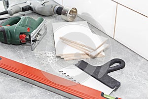 Ceramic tiles and tools for tiler, tiles installation. Home improvement, renovation - ceramic tile floor adhesive