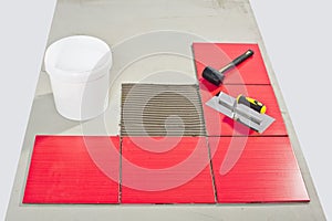 Ceramic tilles and tile adhesive on floor