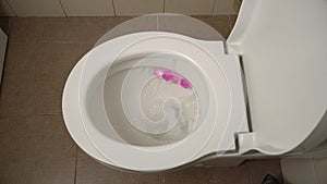 Ceramic Toilet During a Flush, Close-up from Above