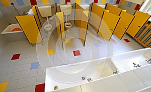 Ceramic toilets and sinks in the bathroom of the kindergarten