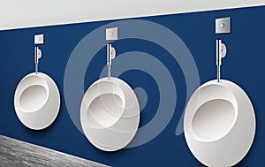 Ceramic urinals in men`s public bathroom