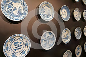 Ceramic wall decorative. plates on the dark wall