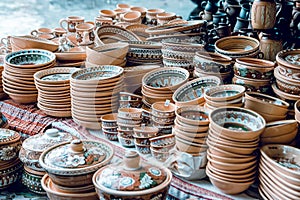 Handmade ceramic toy at a city fair. A lot of clay products. City fairs. photo