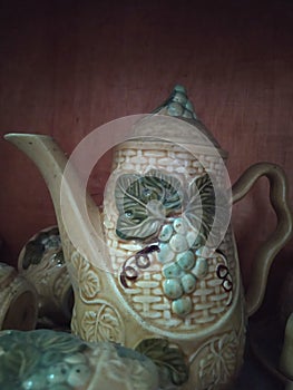 ceramic water jar with a grape bush pattern