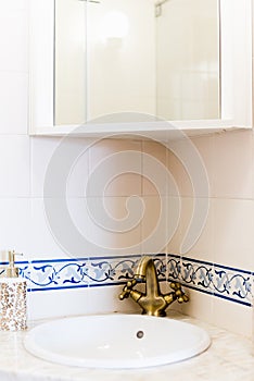 Ceramic Water tap sink with faucet with decorative flower in expensive loft bathroom or kitchen