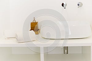 Ceramic Water tap sink with faucet with soap and towel in expensive loft bathroom or kitchen