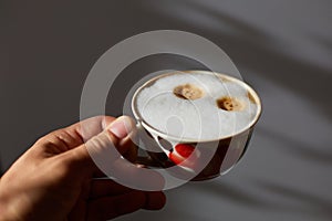 Ceramic white mug of fresh aromatic coffee with milk prepared coffee machine