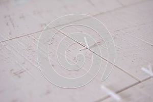 Ceramic wood effect tiles and tools for tiler on the floor