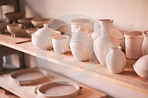 Ceramics background, shelf and pottery in studio, creative store or manufacturing startup. Clay design, collection and