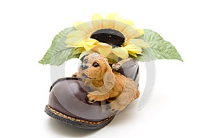 Ceramics dog on shoe with sunflower