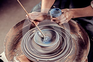 Ceramist girl posing while making earthenware. Handmade. Close-up.