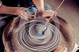 Ceramist girl posing while making earthenware. Handmade. Close-up.