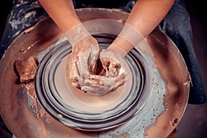 Ceramist girl sculpts from clay. Folk craft. Close-up.