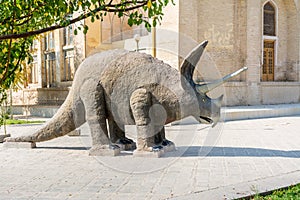 Ceratopsian dinosaur stone sculpture inside of Isfahan museum of natural history next to Palace Chehel Sotoun in Esfahan, Iran