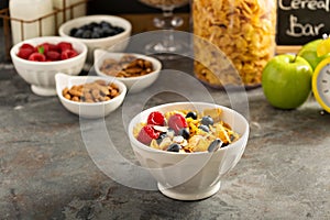 Cereal bar or buffet wih cornflakes, fruit and nuts