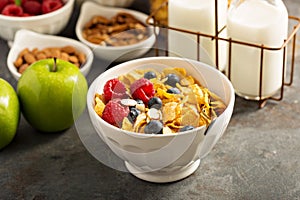 Cereal bar or buffet wih cornflakes, fruit and nuts photo