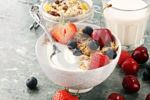 Cereal. Bowl of granola cereals, fruits and milk for breakfast. Muesli with cereals