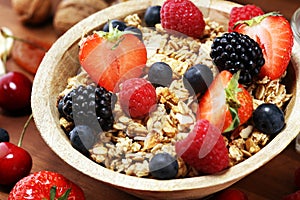 Cereal. Bowl of granola cereals, fruits and milk for breakfast. Muesli with cereals