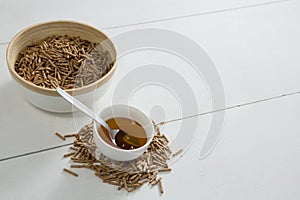 Cereal bran sticks and honey in bowl