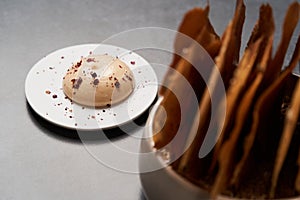 Cereal Chips with Seeds and kimchi mayonnaise sauce on dark background