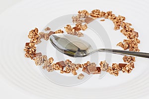 Cereal muesli breakfast and spoon on white background. Healthy eating and lifestyle concept