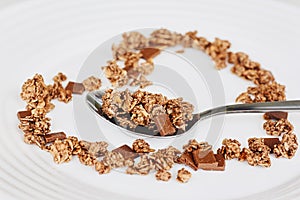 Cereal muesli breakfast and spoon on white background. Healthy eating and lifestyle concept