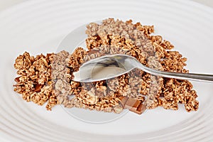 Cereal muesli breakfast and spoon on white background. Healthy eating and lifestyle concept