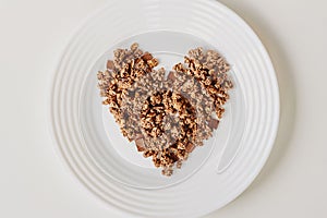 Cereal muesli breakfast on white background. Healthy eating and lifestyle concept
