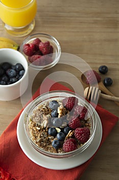 Cereal, muesli and various delicious fruit, berries for breakfast. healthy, energy breakfast, wooden table