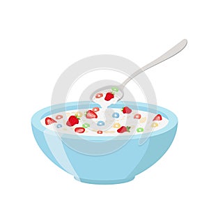 Cereal rings, strawberry, spoon and bowl. Oatmeal breakfast with milk