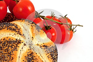 Cereal rolls and fresh tomatoes