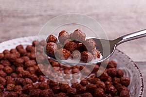 Cereales brekfast with milk. Wooden background