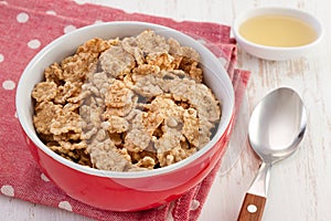 Cereals in the bowl with honey
