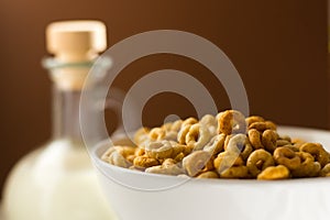 Cereals in a bowl with milk can