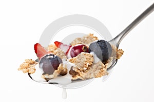 Cereals bowl with red fruits isolated on white
