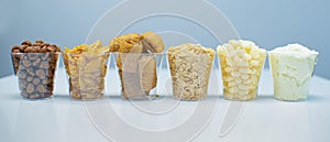 Cereals of Different types in a cup as a breakfast Concept