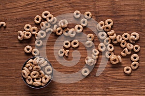 Cereals in metal bowl on brown wooden table