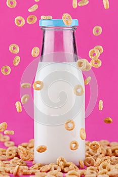 Cereals rings and milk bottle