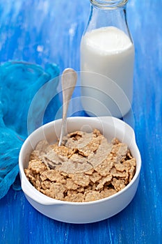 Cereals in white bowl with milk