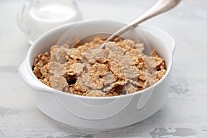 Cereals in white bowl with milk