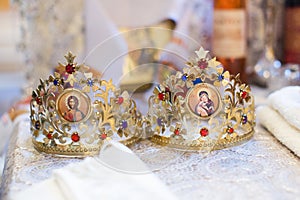 Ceremonial crowns as orthodox wedding accessories.