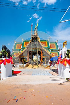 The ceremony of mounting the gable-finial at Phrathat San Don temple