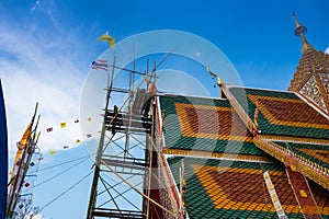The ceremony of mounting the gable-finial at Phrathat San Don temple photo
