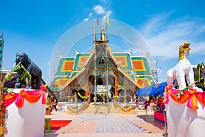 The ceremony of mounting the gable-finial at Phrathat San Don temple photo